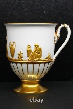 Antique Meissen Cup and Saucer with Gold Figures in Relief on White