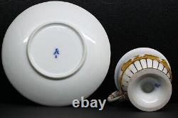 Antique Meissen Cup and Saucer with Gold Figures in Relief on White