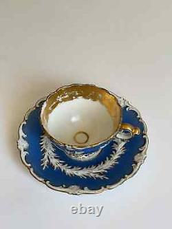 Antique meissen blue and white with gold floral teacup and saucer 1925